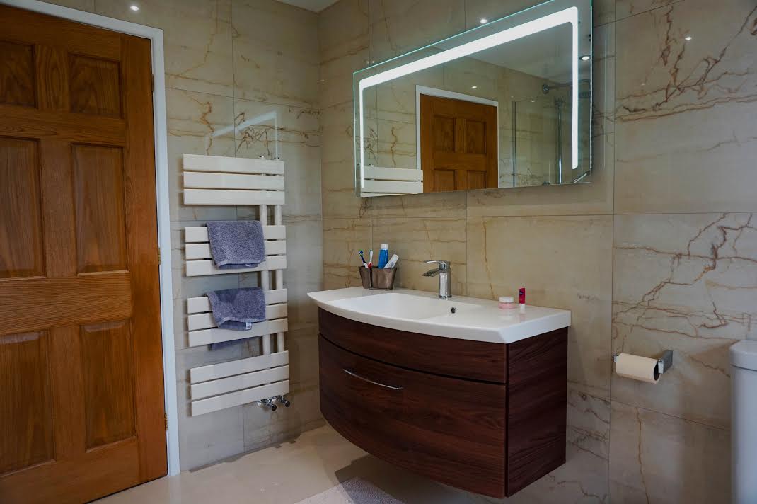 Leedham Residence Ivory and Walnut bathroom design