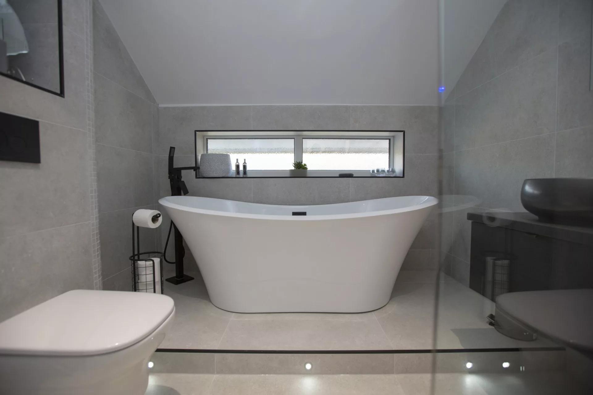 Grey and matte black blend bathroom design